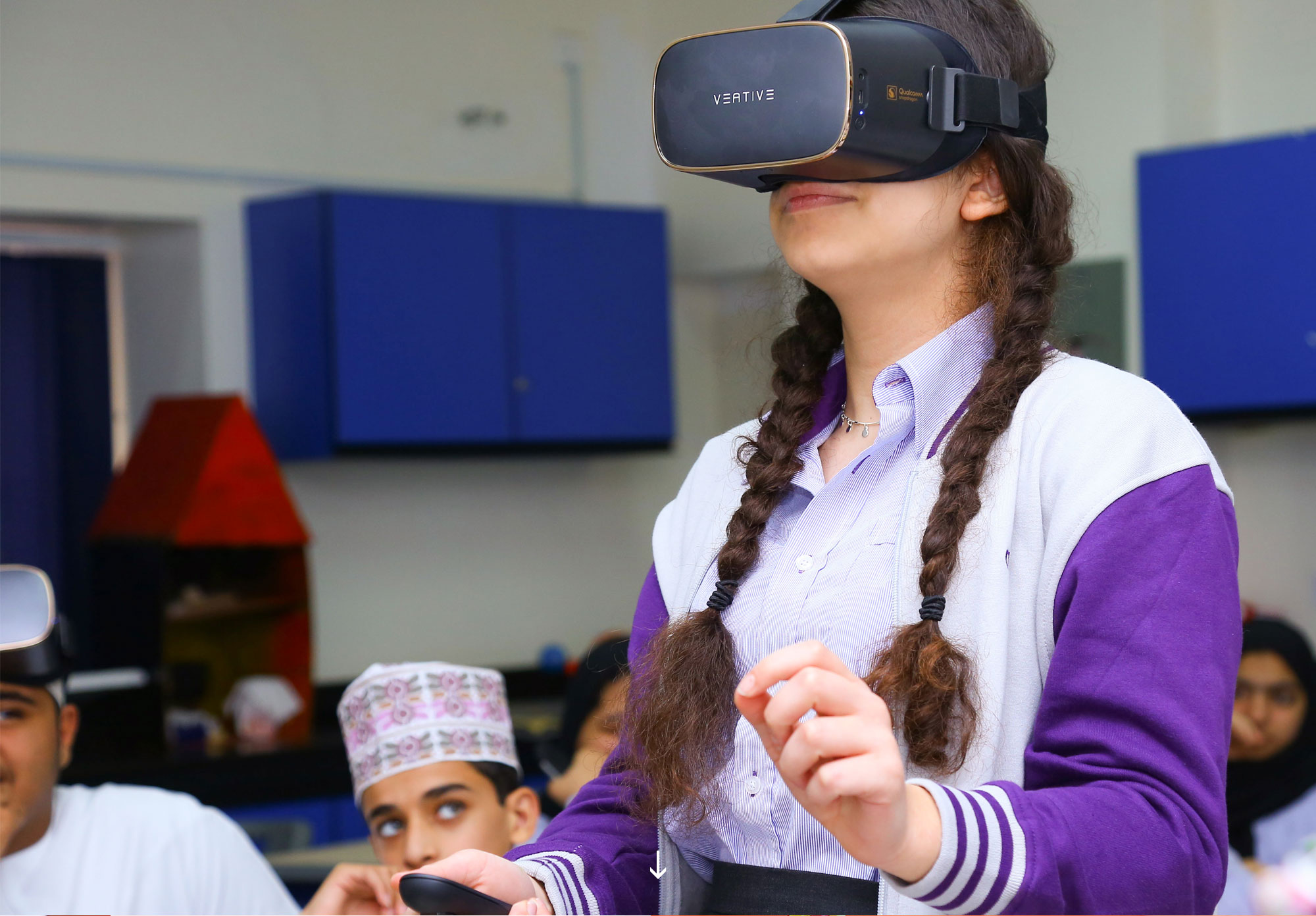Young woman wearing virtual reality goggles